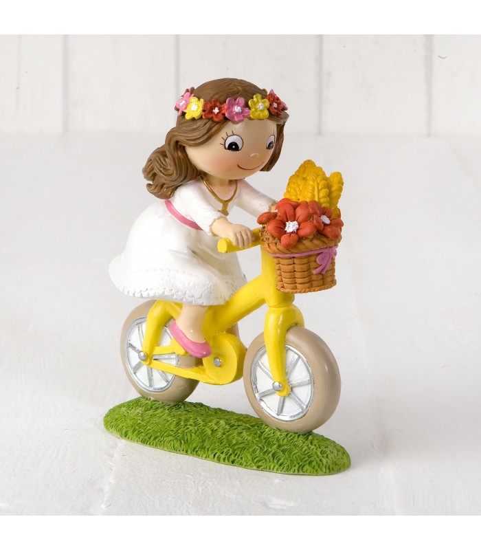Figura pastel Niña Comunión en bicicleta